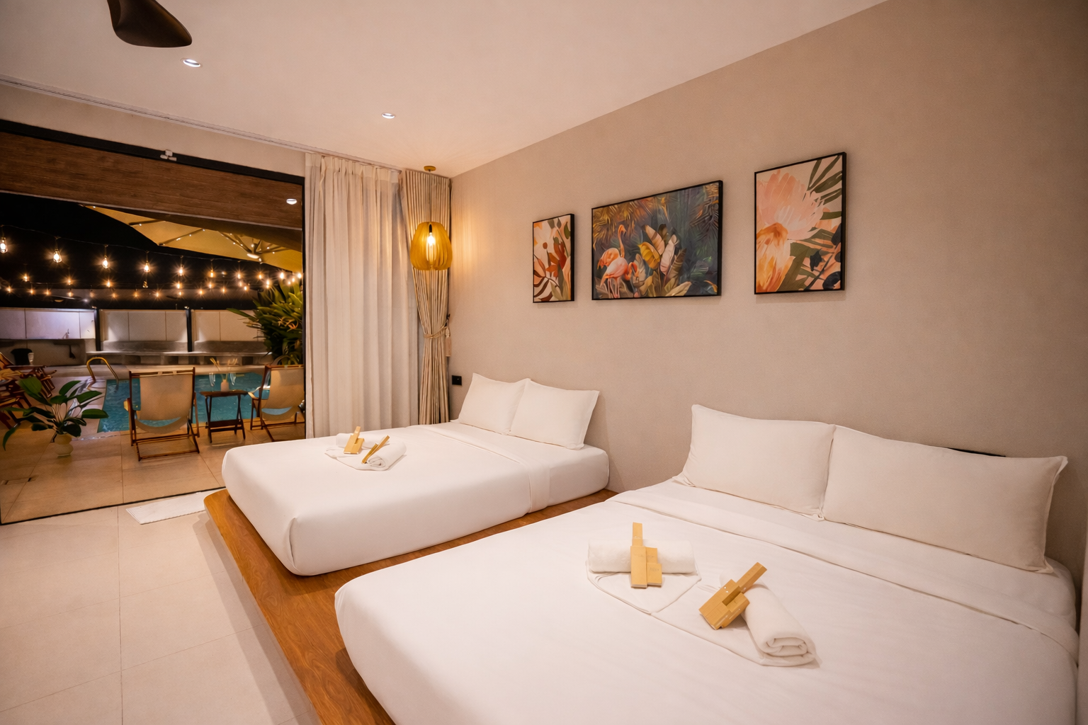 Two queen beds with a sliding door that leads to the swimming pool outside.